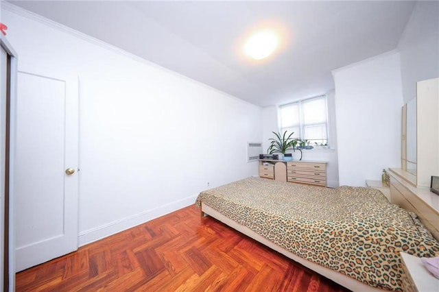 bedroom featuring baseboards and ornamental molding