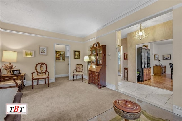 living area featuring carpet flooring, crown molding, a notable chandelier, and baseboards