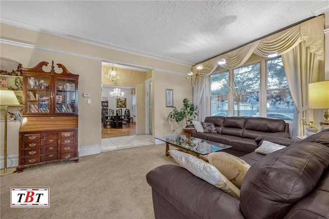 living area featuring a textured ceiling, ornamental molding, a notable chandelier, and carpet flooring