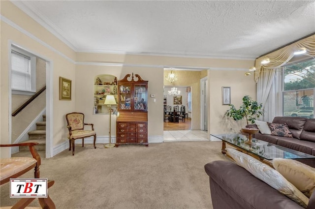 carpeted living area featuring crown molding, stairway, a notable chandelier, and a textured ceiling