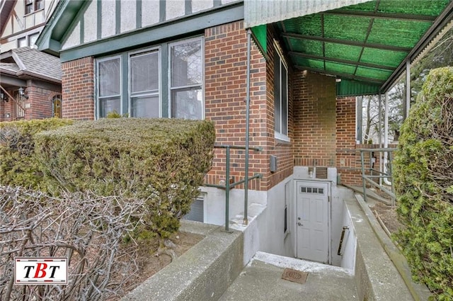 view of side of home with brick siding