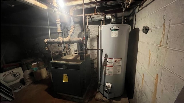 utility room with a heating unit and gas water heater