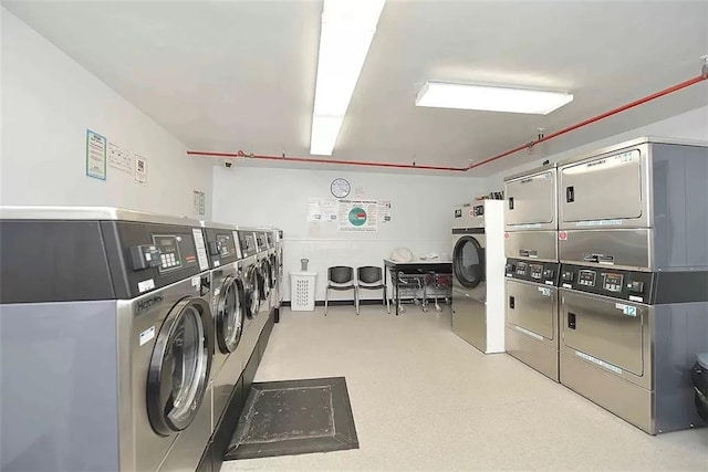 common laundry area featuring stacked washer / dryer and washing machine and dryer