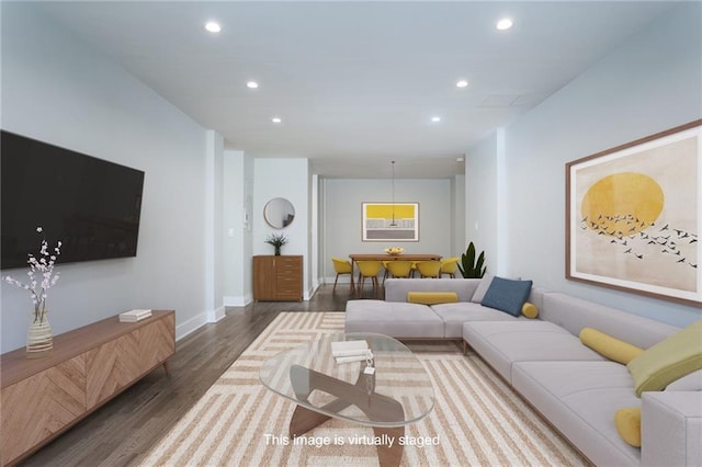 living room with baseboards, wood finished floors, and recessed lighting