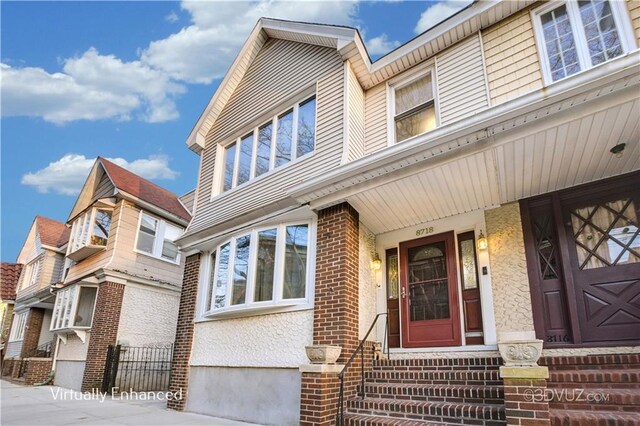 entrance to property with brick siding