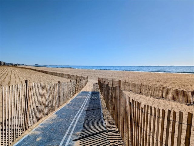 view of water feature with a beach view