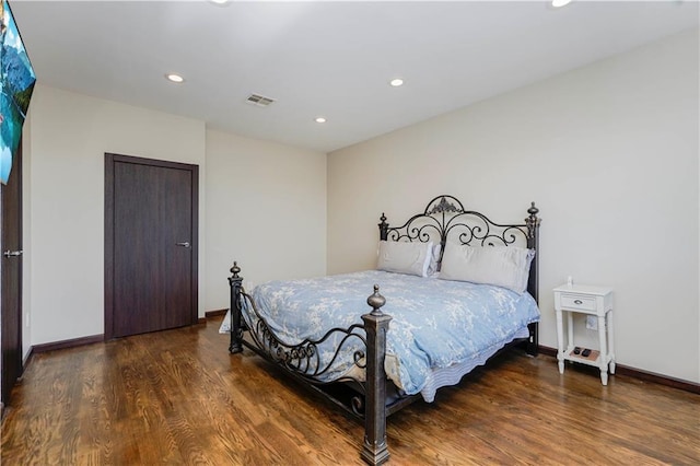 bedroom with recessed lighting, visible vents, and wood finished floors