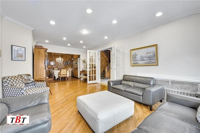 living area with ornamental molding, recessed lighting, and light wood-style flooring