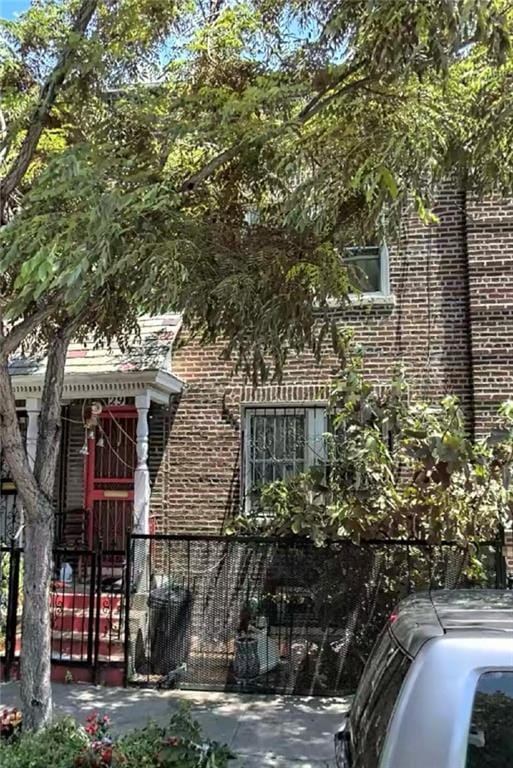 29 Veronica Pl, Brooklyn, NY 11226 - view of property exterior with brick siding, a gate, and cooling unit
