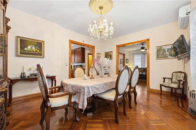 dining room with baseboards and a chandelier