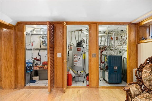 interior space with gas water heater and a heating unit