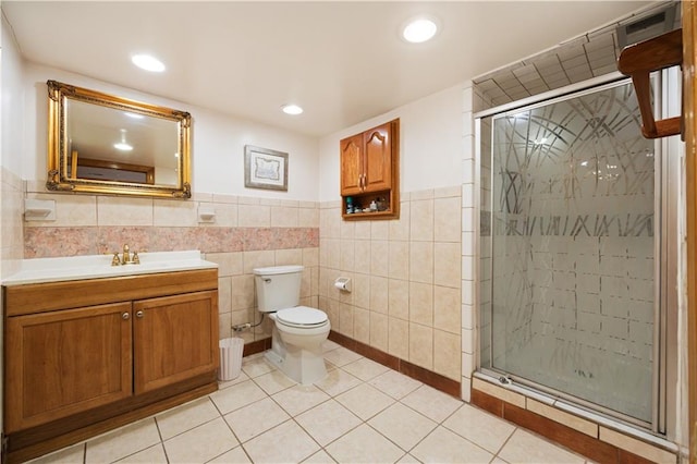 full bath featuring tile patterned flooring, toilet, recessed lighting, vanity, and a stall shower