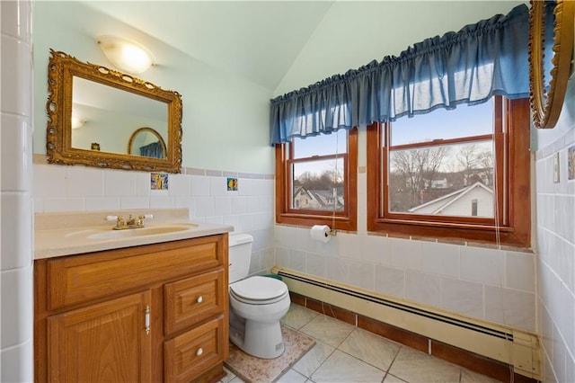 bathroom featuring lofted ceiling, tile patterned flooring, toilet, a baseboard heating unit, and tile walls