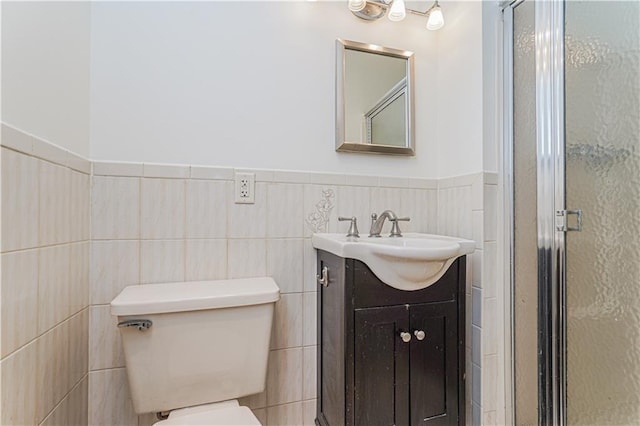 122 Prospect Park SW Unit 10, Brooklyn, NY 11218 - full bathroom featuring vanity, a shower stall, wainscoting, and tile walls