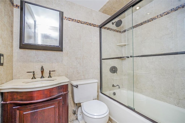 122 Prospect Park SW Unit 10, Brooklyn, NY 11218 - bathroom featuring tile walls, vanity, and combined bath / shower with glass door