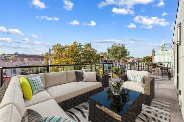 view of patio / terrace featuring outdoor lounge area and a balcony