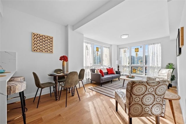 interior space featuring light wood-type flooring and baseboards