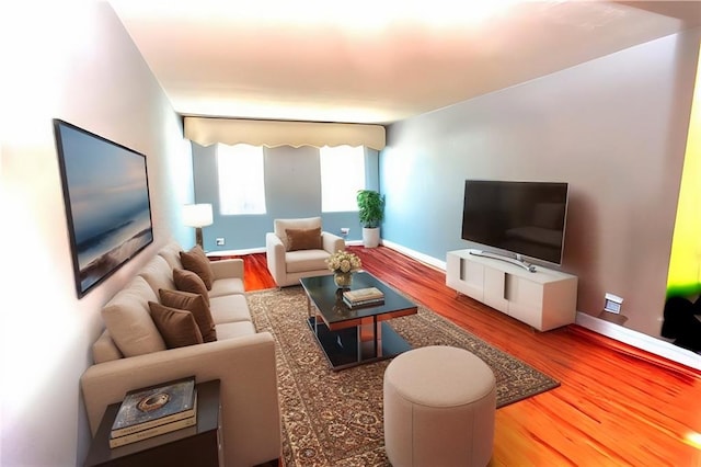 living room featuring wood finished floors and baseboards