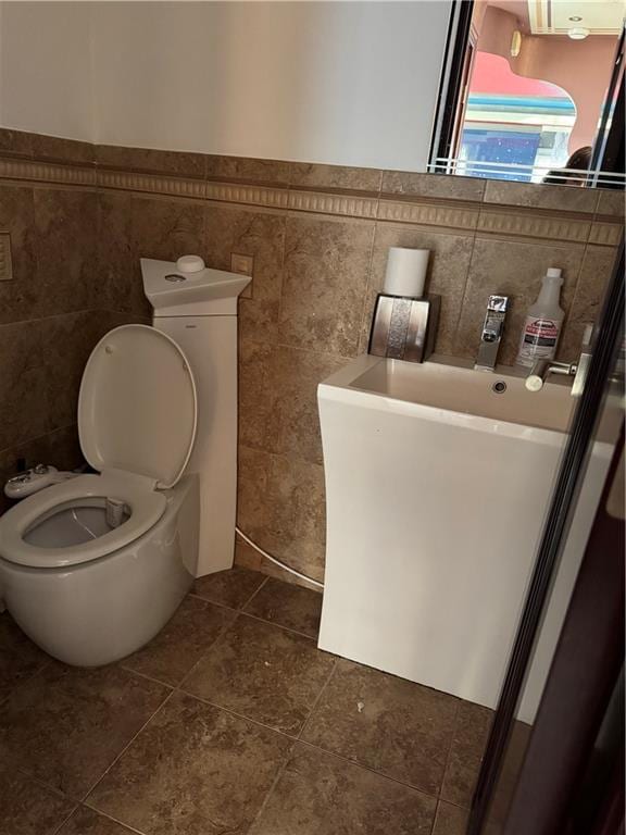 bathroom featuring tile patterned floors and toilet