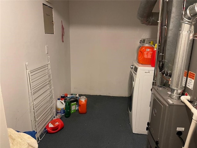 washroom featuring independent washer and dryer, electric panel, and laundry area