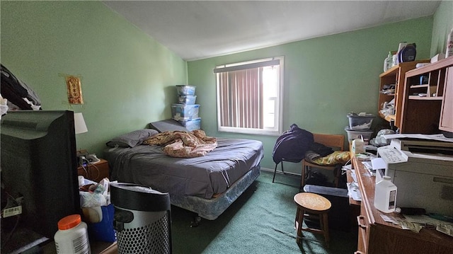 carpeted bedroom featuring lofted ceiling