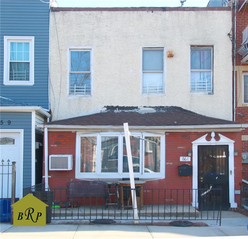 661 E 87th St, Brooklyn, NY 11236 - townhome / multi-family property with stucco siding, a fenced front yard, and roof with shingles