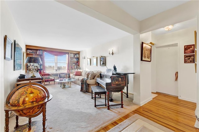 living room featuring baseboards and wood finished floors