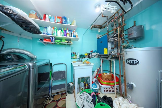 laundry room with washer and dryer, laundry area, and water heater