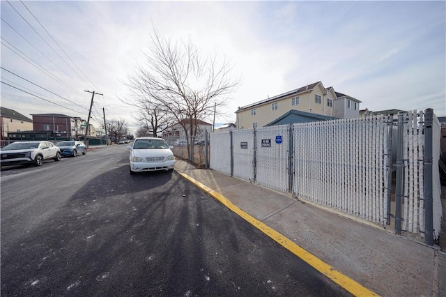 view of road with sidewalks and curbs