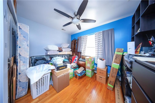 storage area featuring visible vents and ceiling fan