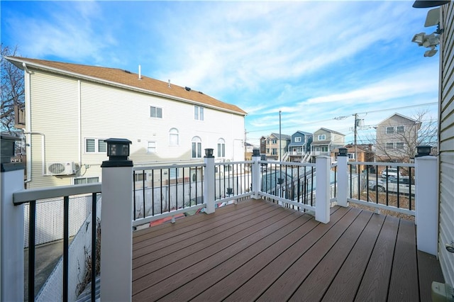 wooden deck featuring a residential view