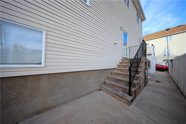 view of home's exterior with fence