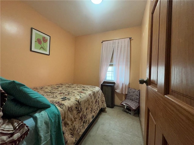 bedroom featuring light colored carpet