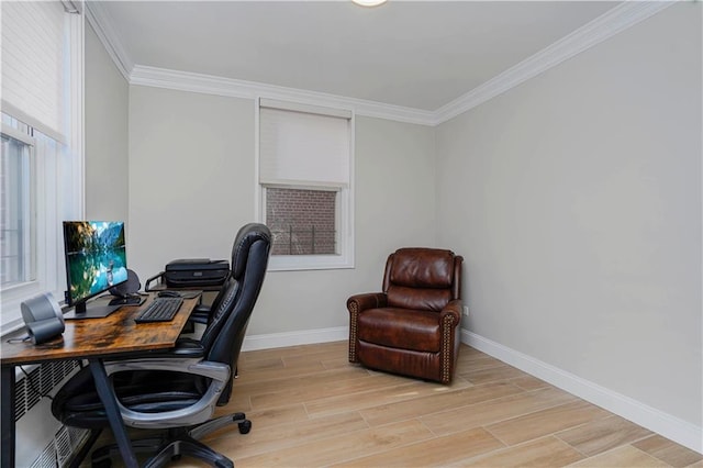 office space with baseboards, light wood-type flooring, and crown molding