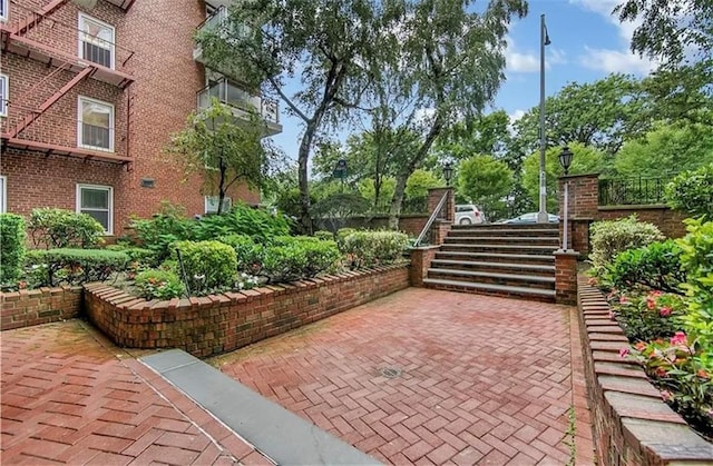 view of patio / terrace featuring stairs