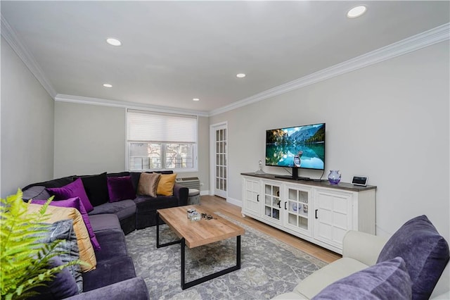 living room featuring recessed lighting, baseboards, crown molding, and wood finished floors