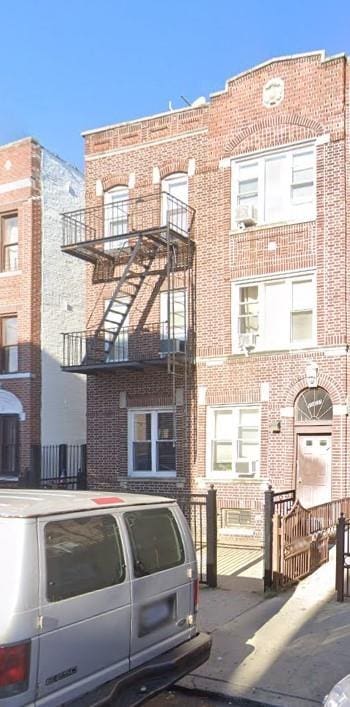 view of front of house featuring brick siding