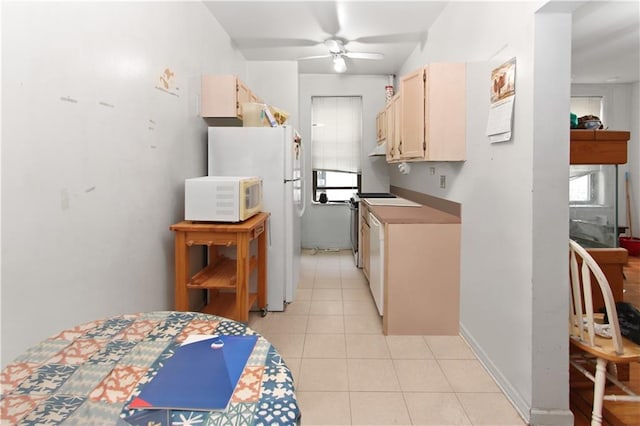 kitchen with light tile patterned floors, electric range oven, white microwave, a ceiling fan, and baseboards