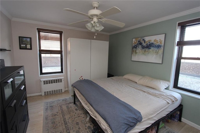 2212 Plumb 1st St Unit 1C, Brooklyn, NY 11229 - bedroom with radiator heating unit, multiple windows, light wood-type flooring, and ornamental molding