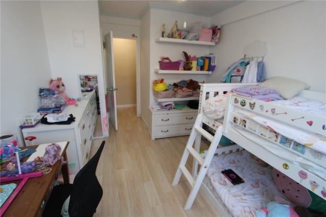 bedroom featuring light wood-style flooring