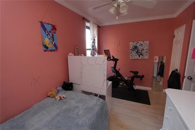 bedroom with crown molding, light wood-type flooring, and ceiling fan