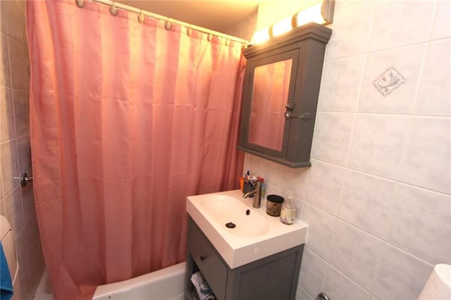 2212 Plumb 1st St Unit 1C, Brooklyn, NY 11229 - bathroom with vanity, tile walls, and shower / bath combination with curtain