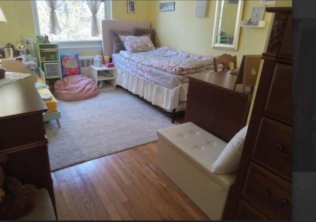 bedroom with wood finished floors