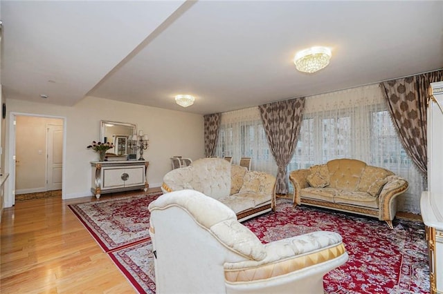 living room featuring baseboards and wood finished floors