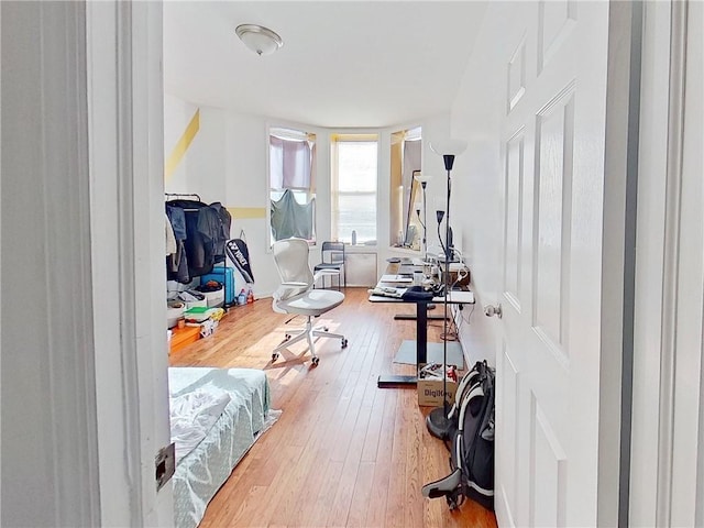 workout area with wood-type flooring