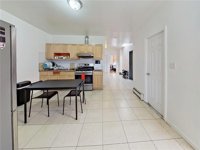 kitchen featuring appliances with stainless steel finishes, baseboard heating, light brown cabinetry, under cabinet range hood, and light tile patterned flooring