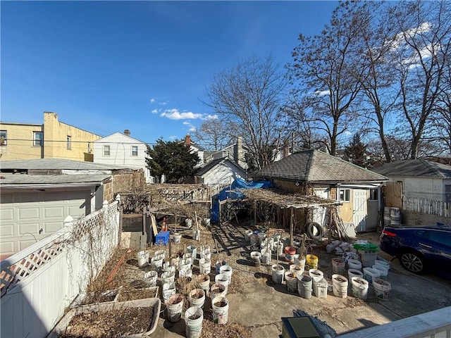 exterior space with an outbuilding and fence