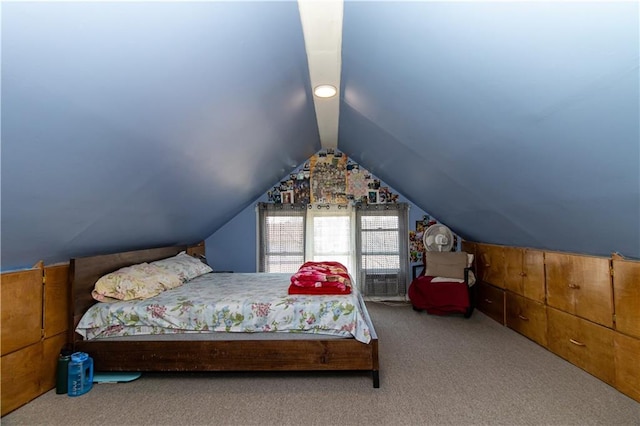 carpeted bedroom featuring lofted ceiling