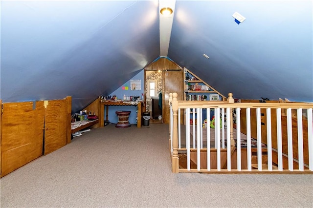 bonus room featuring lofted ceiling and carpet