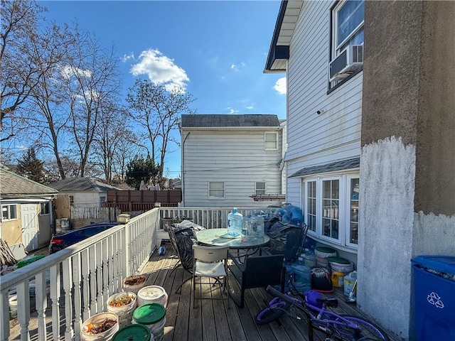 wooden deck featuring cooling unit